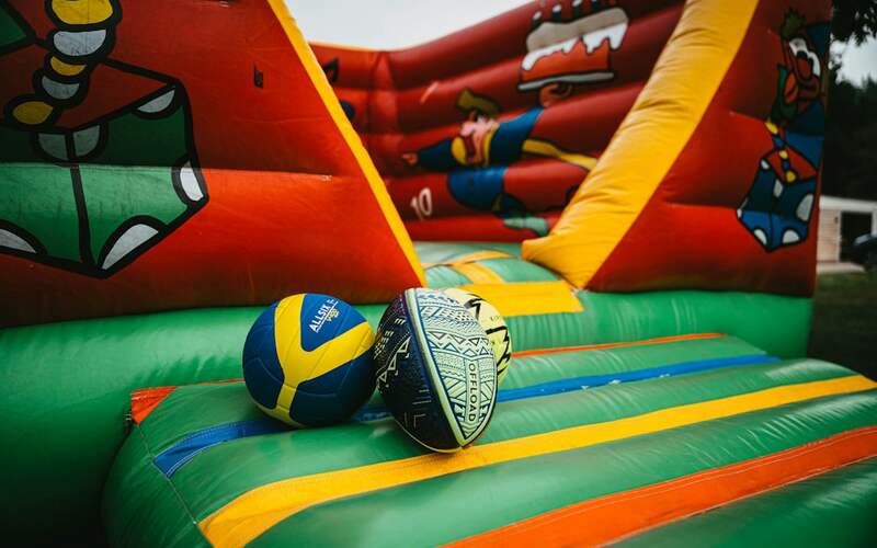 Inside a brightly coloured inflatable jumping castle